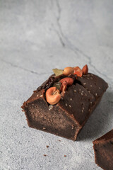 Banana Bread Loaf with nut on grey background. Morning breakfast background. Close up view recipes for healthy diet.