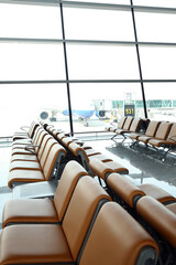 rows of chairs in a Terminal waiting hall