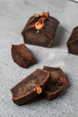 Banana Bread Loaf with nut on grey background. Morning breakfast background. Close up view recipes for healthy diet.