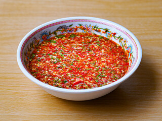 Close up Thai spicy seafood dipping sauce the popular to eat with delicious seafood increases color of fresh red chilli sauce