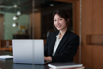 Modern Asian Business woman have confident working with financial team by video conference at office. Accounting concept.