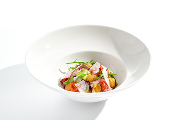 Roast beef and grilled vegetables salad isolated on white background. Steak salad with pastrami, eggplant, tomato, remoulade sauce with parmesan flakes. Gourmet dish  with grilled meat