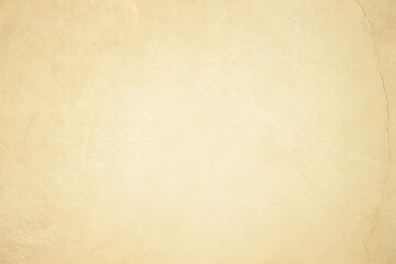 Brown concrete wall. Warm beige rough grainy stone texture background.