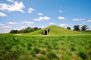 1000 year old prehistoric earth lodge of native Indian Mississippi Culture at Ocmulgee National Monument, Macon, Georgia, USA