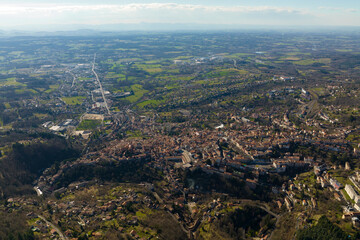 Aerial view of dense historic center of Thiers town in Puy-de-Dome department, Auvergne-Rhone-Alpes region in France. Rooftops of old buildings and narrow streets