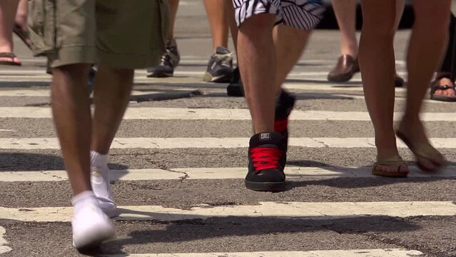 Chicago street scene, pedestrian crossing close up with feet