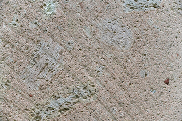 Stone texture. Detailed shot of sawn stone. Circular saw marks on the rough surface. Abstract multitasking background