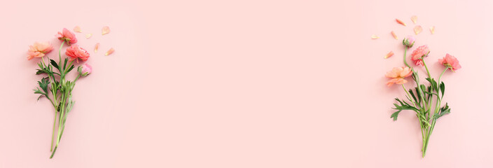 Top view image of pink flowers composition over pastel background