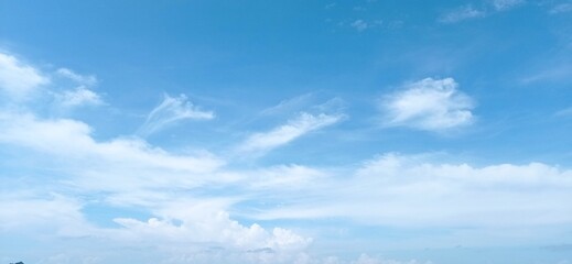 Naklejka na ściany i meble blue sky and cumulus clouds background