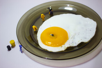 Researchers are examining a person who drowned in an egg yolk on a plate