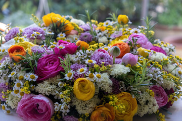 Fresh wild flower and herb wreath close up. Garden nature and Spring. Women or Mothers day bouquet