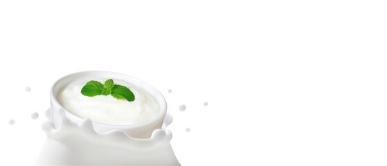 Yogurt in bowl falling in to the milk splashed isolated on white background with space, The...