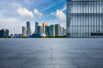 Empty square floor and city skyline with modern commercial buildings in Hangzhou, China. City...