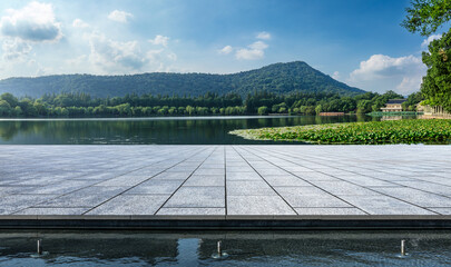 Empty square platform and beautiful lake with mountain natural landscape in Hangzhou, China.