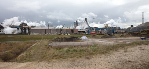 Fototapeta na wymiar Steel factory plant with chimneys