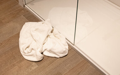 Towel on a floor in a hotel bathroom