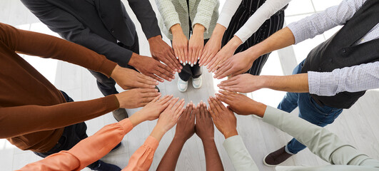 Narrow banner of diverse multiracial people join hands in circle engaged in teambuilding activity...