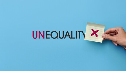 Inscription: inequality and the cross icon. A symbol of the prohibition of inequality among people