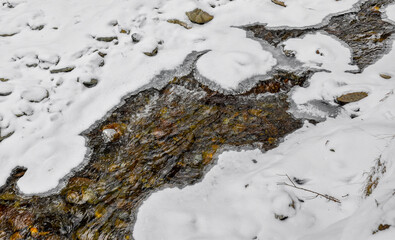River in the mountains in winter, snow landscape