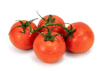 Red cherry tomatoes bunch closeup in white backgroud isolated with nobody extendable background shot using studio lighting and macro 100mm lens. 