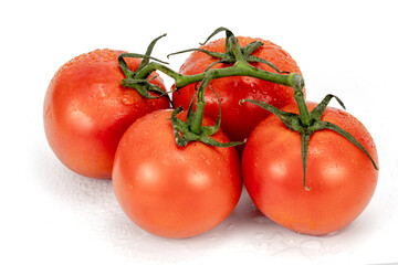 Red cherry tomatoes bunch closeup in white backgroud isolated with nobody extendable background shot using studio lighting and macro 100mm lens. 