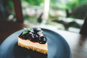 blueberry cheese pie sweet dessert tasty concept, pie cake with cream and berry fruits and sugar, cheesecake bakery slice on coffee cafe table - obrazy, fototapety, plakaty