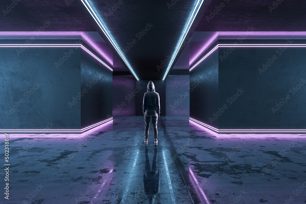 Poster back view of hacker in futuristic space corridor interior with purple lights. technology and archite