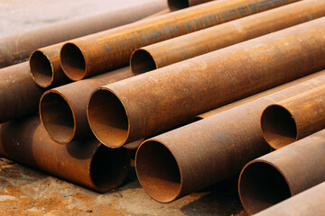 Metal pipes of various diameters for gasification or water supply. Industrial background. Promotional photo for pipe suppliers with copy of space