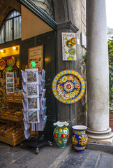 Traditional ceramic plates in souvenir shop in Amalfi	
