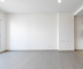 Bright empty interior with two large window, city view and blank gray wall.