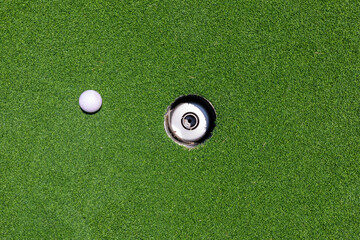 golf ball on golf course, background of green grass, minimalism concept