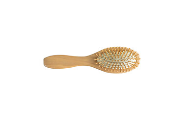 wooden massage hairbrush on table. comb,equipment for dressing on the wood table