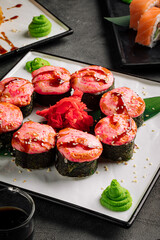 Closeup on baked cheese sushi rolls portion