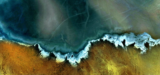 abstract landscape photo of the deserts of Africa from the air emulating the shapes and colors of a...