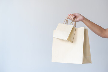 Woman carrying paper bag concept of reuse, recycle the object to zero waste. Concept of...