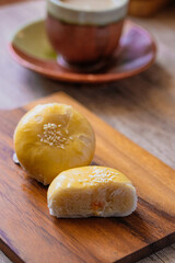 Chinese Pastry Mooncake with soybeans on the wooden floor