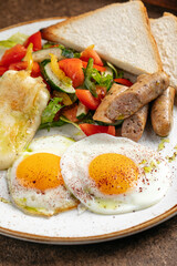 Closeup on german breakfast with fried eggs and sausages