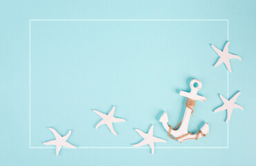 Blue colored summer and vacation background, anchor and sea stars building a frame, copy space for text, holiday and tourism concept © Berit Kessler