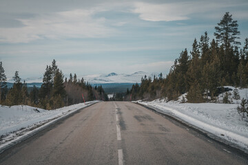 A roadtrip through Sweden Jämtland (Lapland). Endless road winding towards Helags Mountains....