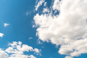 Beautiful white fluffy clouds slowly float against the blue sky on a warm sunny summer day. Timelapse video of cloud movement high quality 4k.