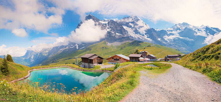 wonderful hiking route to Kleine Scheidegg, accumulation lake and mountain view, switzerland