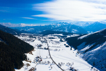 Fototapeta na wymiar Panorama aerial view from the Dachstein Glacier. The plateau is the best place for skiing, snowboarding and other winter sports, Styria, Austria. Tourism and vacations concept.