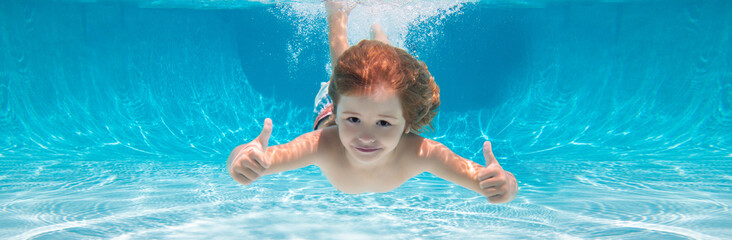 Child swimming underwater with thumbs up. Underwater kid swim under water. Child boy swimming and diving underwater in pool. Banner for header, copy space. Poster for web design. - obrazy, fototapety, plakaty