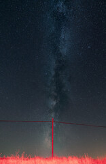 Antique wooden pole under the milky way