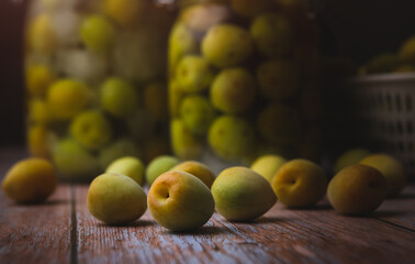 Homemade pickled plum with liquor and rock sugar in the glass bottle.