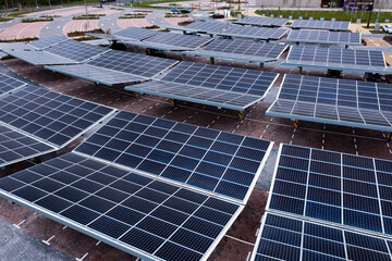 Aerial view of solar panels on a parking lot rooftop