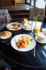 Delicious Breakfast for Two at the Luxury Hotel, Eggs, Sausages, Vegetables, Croissants Coffee, Orange Juice