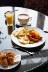 Delicious Breakfast for Two at the Luxury Hotel, Eggs, Sausages, Vegetables, Croissants Coffee, Orange Juice