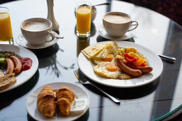 Delicious Breakfast for Two at the Luxury Hotel, Eggs, Sausages, Vegetables, Croissants Coffee, Orange Juice