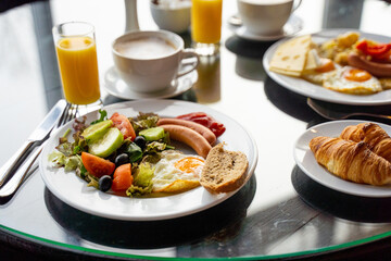 Delicious Breakfast for Two at the Luxury Hotel, Eggs, Sausages, Vegetables, Croissants Coffee, Orange Juice